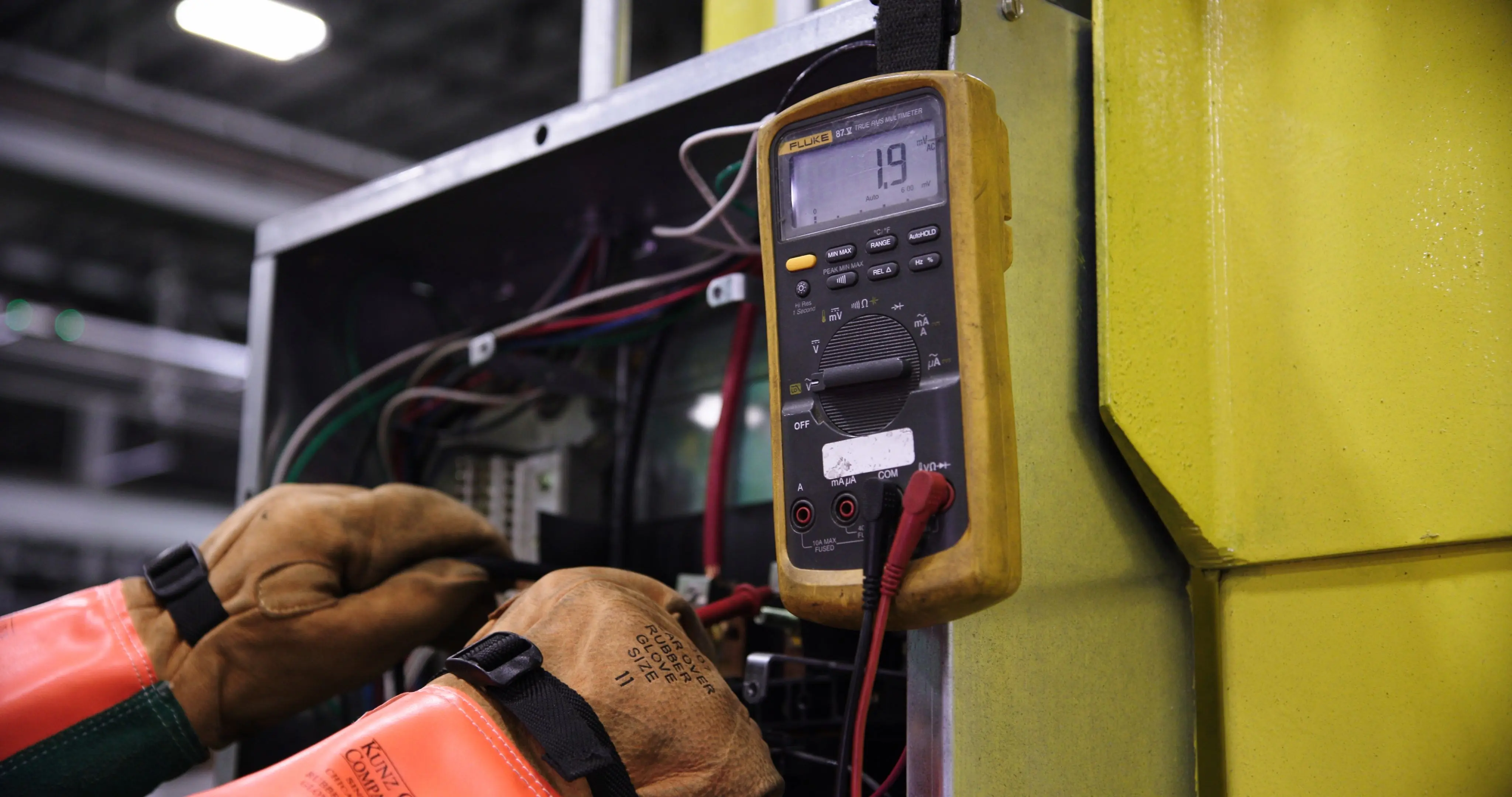 Electrician installing electrical wall sockets